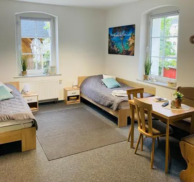 Ein Bett oder Betten in einem Zimmer der Unterkunft FEWO Edisonstraße