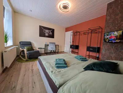 Ein Bett oder Betten in einem Zimmer der Unterkunft König - Ferienwohnung Waldheim