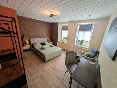 Ein Bett oder Betten in einem Zimmer der Unterkunft König - Ferienwohnung Waldheim