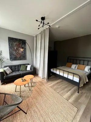 Ein Bett oder Betten in einem Zimmer der Unterkunft K2-Project - Kleines Loft beim Schlossteich