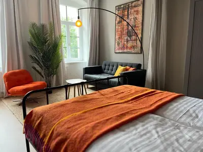 Ein Bett oder Betten in einem Zimmer der Unterkunft K2-Project - Kleines Loft beim Schlossteich
