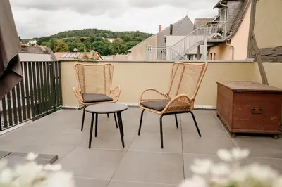 Ein Balkon oder eine Terrasse in der Unterkunft Urlaubsfreude Biedermann Haus Blumenglück - Vergissmeinnicht