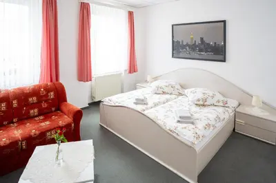 Ein Bett oder Betten in einem Zimmer der Unterkunft Hotel Bavaria