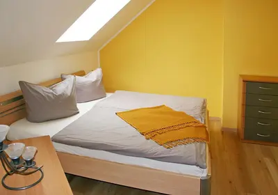 Ein Bett oder Betten in einem Zimmer der Unterkunft Ferienwohnung Villa Maria