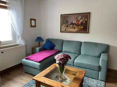 Ein Sitzbereich in der Unterkunft Ferienwohnung an der Rosenstraße