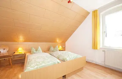 Ein Bett oder Betten in einem Zimmer der Unterkunft Hotel Deutsches Haus