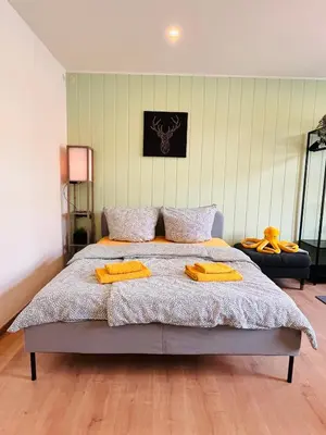 Ein Bett oder Betten in einem Zimmer der Unterkunft Makro Apartment Großenhain