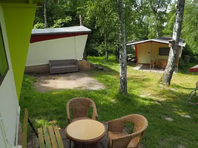 Ein Garten an der Unterkunft TRABI- Bungalows am Naturteich