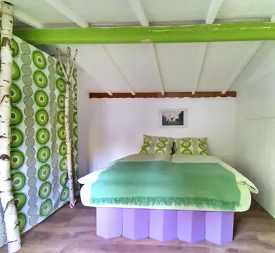 Ein Bett oder Betten in einem Zimmer der Unterkunft TRABI- Bungalows am Naturteich