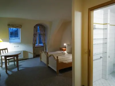 Ein Bett oder Betten in einem Zimmer der Unterkunft Schloss Friedrichstal Arabi-Ka