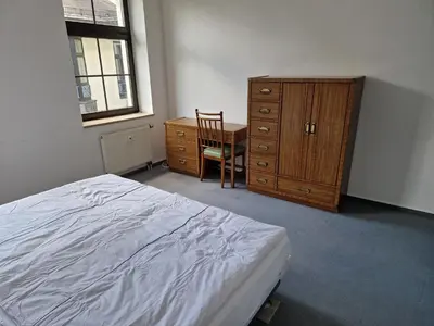 Ein Bett oder Betten in einem Zimmer der Unterkunft Gästezimmer North Carolina in Chemnitz