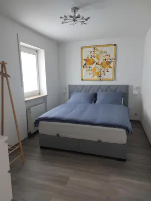 Ein Bett oder Betten in einem Zimmer der Unterkunft Einsiedel Gartenblick