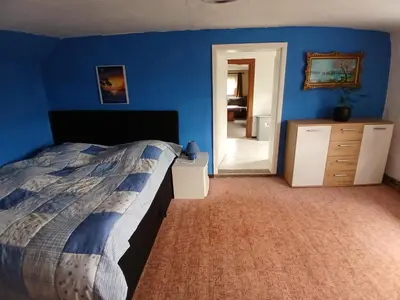 Ein Bett oder Betten in einem Zimmer der Unterkunft Ferienwohnungen Sommerfrische Lindenhaus