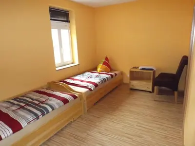 Ein Bett oder Betten in einem Zimmer der Unterkunft Pension Rego