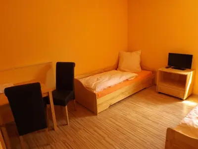 Ein Bett oder Betten in einem Zimmer der Unterkunft Pension Rego