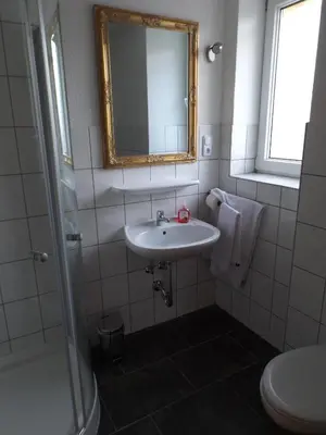 Ein Badezimmer in der Unterkunft Pension Rego