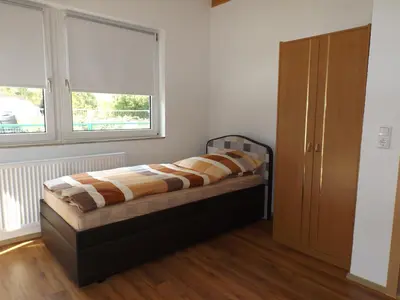 Ein Bett oder Betten in einem Zimmer der Unterkunft Pension Rego