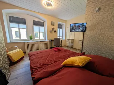 Ein Bett oder Betten in einem Zimmer der Unterkunft Komfortzimmer Waldheim