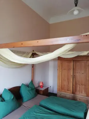Ein Bett oder Betten in einem Zimmer der Unterkunft Schloss Ruhethal