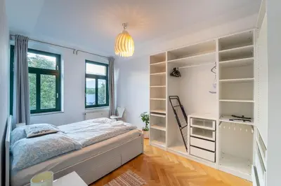 Ein Bett oder Betten in einem Zimmer der Unterkunft Beautiful old building apartment