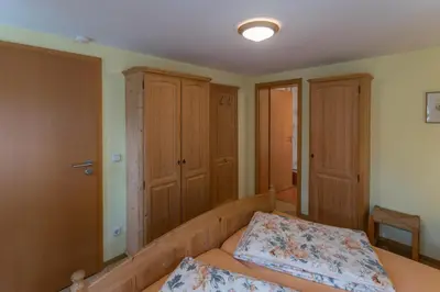 Ein Bett oder Betten in einem Zimmer der Unterkunft Ferienhaus Herta ein charmant, saniertes Einzeldenkmal im Elbsandsteingebirge -Nähe Bad Schandau