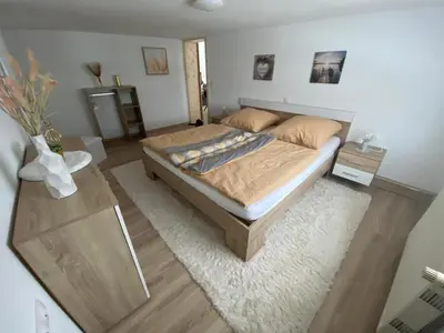 Ein Bett oder Betten in einem Zimmer der Unterkunft Ferienwohnung Fiss Dorfhain
