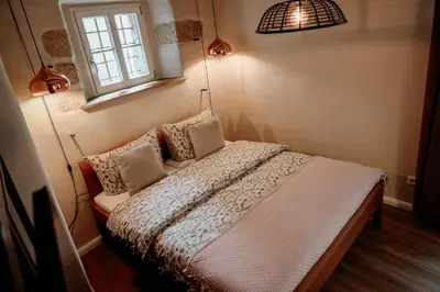 Ein Bett oder Betten in einem Zimmer der Unterkunft Urlaubsfreude Biedermann Haus Blumenglück - Anemone