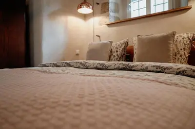 Ein Bett oder Betten in einem Zimmer der Unterkunft Urlaubsfreude Biedermann Haus Blumenglück - Anemone