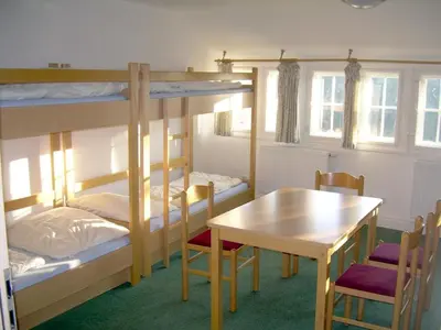 Ein Bett oder Betten in einem Zimmer der Unterkunft Herberge Burg Hohnstein