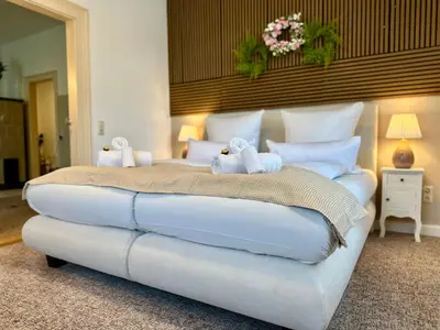 Ein Bett oder Betten in einem Zimmer der Unterkunft Belvedere Apartment - Riverside - Zentrum - Netflix - Liliensteinblick
