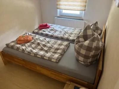 Ein Bett oder Betten in einem Zimmer der Unterkunft Ferienhaus Schwope 04654 Frohburg OT Kohren-Sahlis Friedensstraße 33
