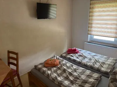 Ein Bett oder Betten in einem Zimmer der Unterkunft Ferienhaus Schwope 04654 Frohburg OT Kohren-Sahlis Friedensstraße 33