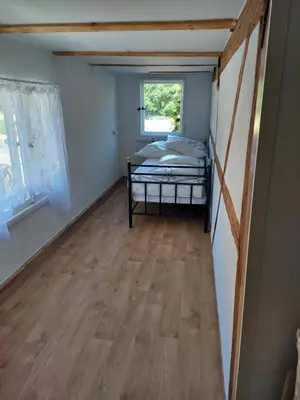 Ein Bett oder Betten in einem Zimmer der Unterkunft Ferienwohnung am Colditzer Forst