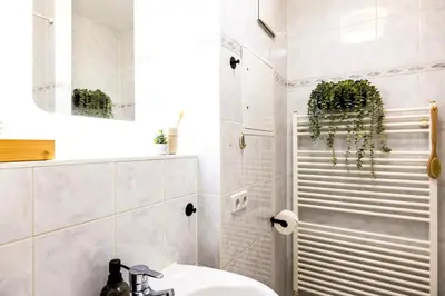 Ein Badezimmer in der Unterkunft StayTime - Honey Base