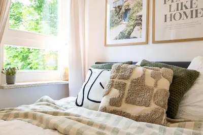 Ein Bett oder Betten in einem Zimmer der Unterkunft StayTime - Olive Nest