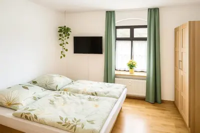 Ein Bett oder Betten in einem Zimmer der Unterkunft Ferienwohnung auf der Schlossallee