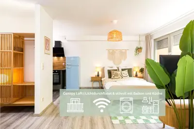 Ein Bett oder Betten in einem Zimmer der Unterkunft StayTime - Canopy Loft