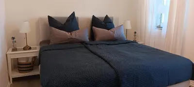 Ein Bett oder Betten in einem Zimmer der Unterkunft Haus am See
