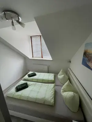 Ein Bett oder Betten in einem Zimmer der Unterkunft Ferienwohnung Domblick