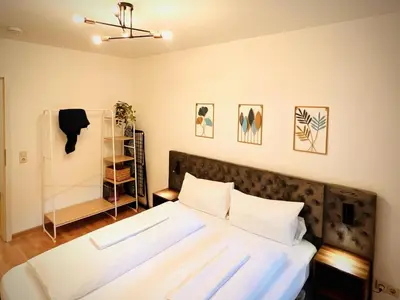 Ein Bett oder Betten in einem Zimmer der Unterkunft Boho-Apartment mit Terrasse - Ruhig & Zentrumsnah