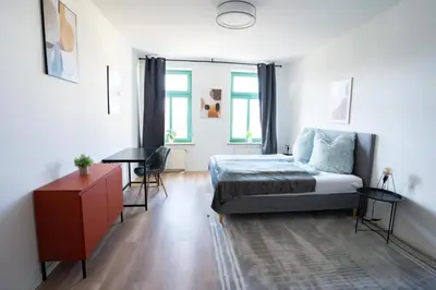 Ein Bett oder Betten in einem Zimmer der Unterkunft Schickes Apartment in Chemnitz-Sonneberg mit 2 Schlafzimmern und Balkon