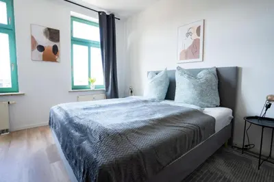 Ein Bett oder Betten in einem Zimmer der Unterkunft Schickes Apartment in Chemnitz-Sonneberg mit 2 Schlafzimmern und Balkon