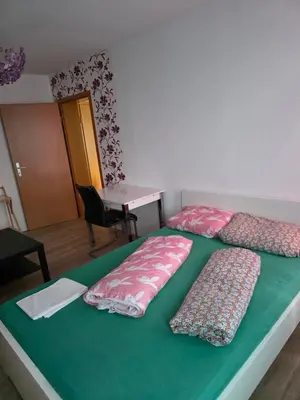 Ein Bett oder Betten in einem Zimmer der Unterkunft Apart Konkordia