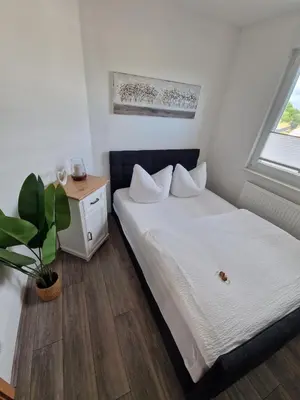 Ein Bett oder Betten in einem Zimmer der Unterkunft Komfortable Ferienwohnung in Hainichen
