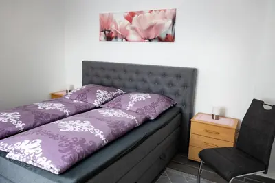 Ein Bett oder Betten in einem Zimmer der Unterkunft Ferienwohnung An der Rennbahn