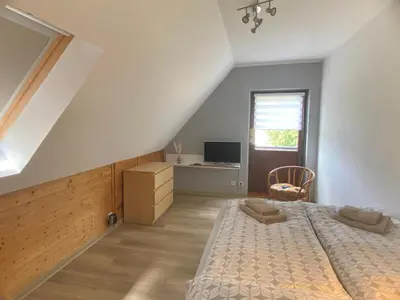 Ein Bett oder Betten in einem Zimmer der Unterkunft Ferienhaus am Röhrensteig