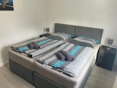 Ein Bett oder Betten in einem Zimmer der Unterkunft Eastside - Apartment WHG 02