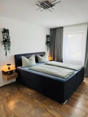 Ein Bett oder Betten in einem Zimmer der Unterkunft Zentraler Moment