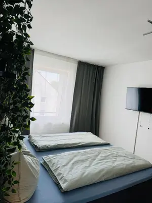 Ein Bett oder Betten in einem Zimmer der Unterkunft Zentraler Moment