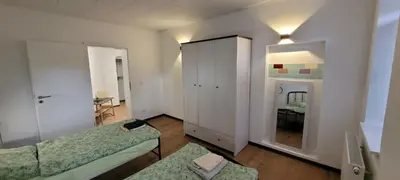 Ein Bett oder Betten in einem Zimmer der Unterkunft Seyfarthrooms - Monteurwohnung Großröhrsdorf 4 - zentrale Lage, gute Anbindung, ideal für 2 Personen